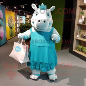 Cyan Rhinoceros mascot costume character dressed with a Dress and Tote bags