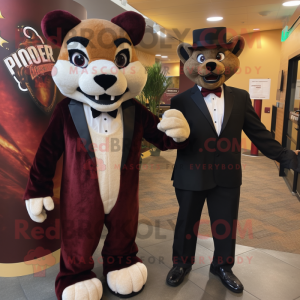 Maroon Mountain Lion mascot costume character dressed with a Tuxedo and Watches