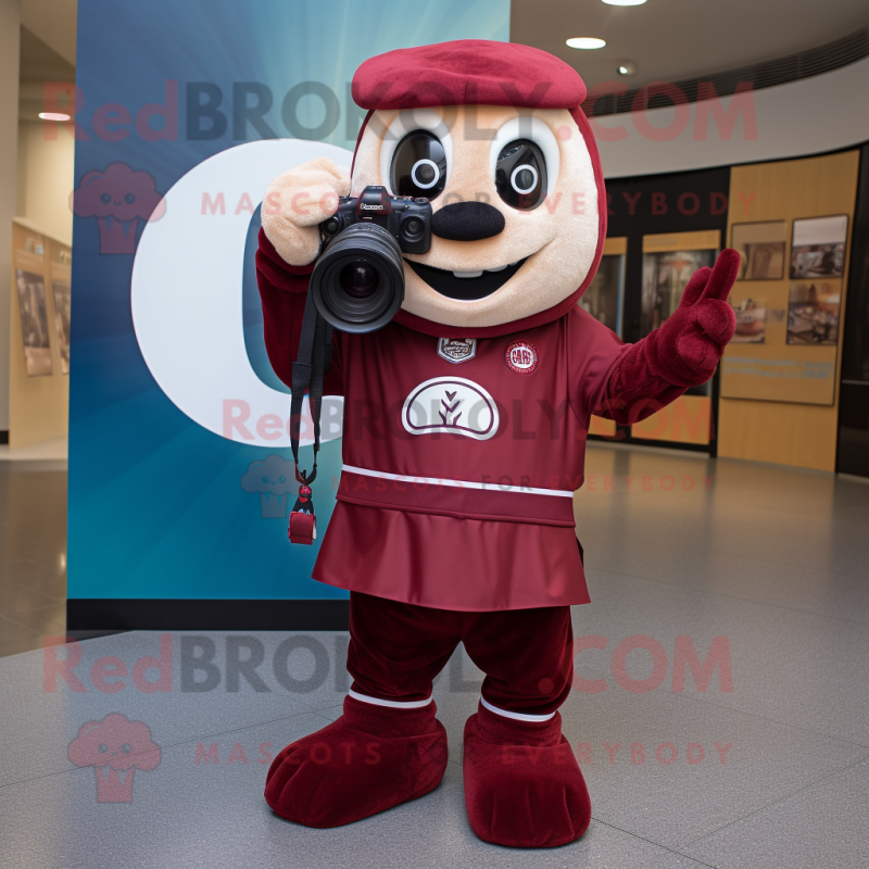 Maroon Camera mascot costume character dressed with a Chinos and Foot pads