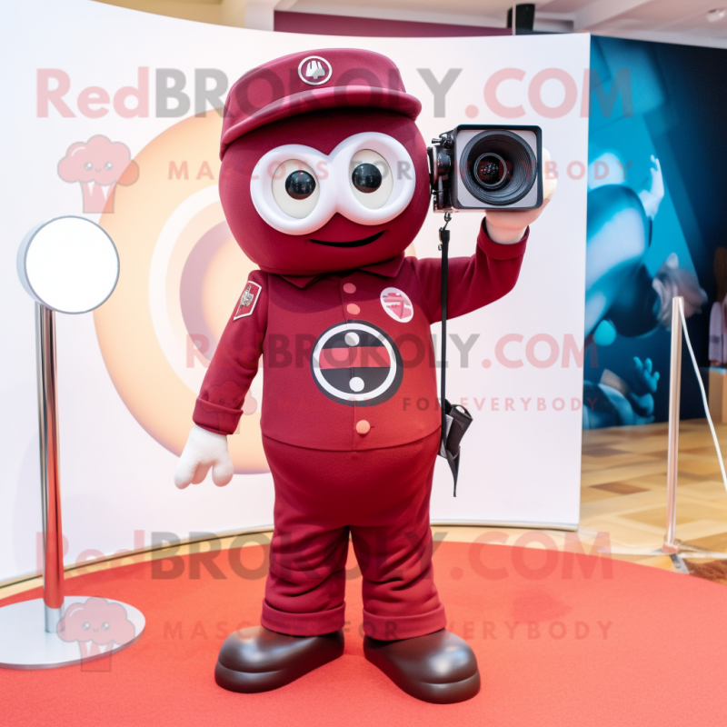 Maroon Camera mascot costume character dressed with a Chinos and Foot pads