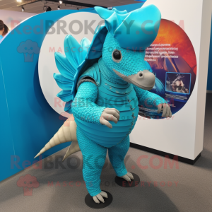 Turquoise Armadillo mascot costume character dressed with a Rash Guard and Cufflinks