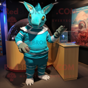 Turquoise Armadillo mascot costume character dressed with a Rash Guard and Cufflinks