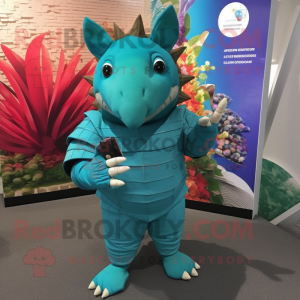 Turquoise Armadillo mascot costume character dressed with a Rash Guard and Cufflinks