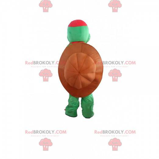 Grünes Schildkrötenmaskottchen mit einer großen Schale -
