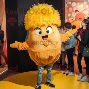 Gold Shakshuka mascot costume character dressed with a Boyfriend Jeans and Hair clips