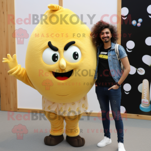 Gold Shakshuka mascot costume character dressed with a Boyfriend Jeans and Hair clips