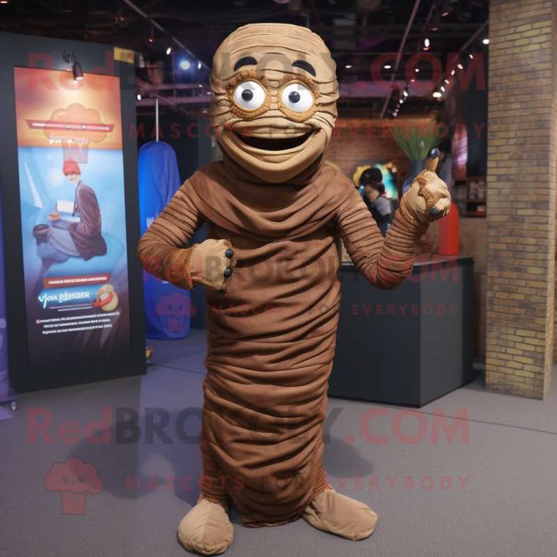 Brown Mummy mascot costume character dressed with a Jacket and Anklets