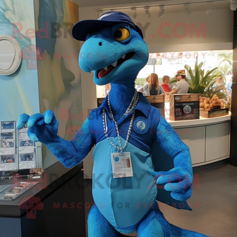 Blue Utahraptor mascot costume character dressed with a Polo Tee and Necklaces Blue Utahraptor mascot costume character dressed with a Polo Tee and Necklaces