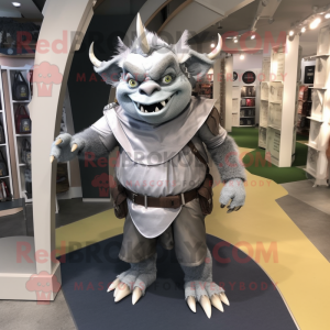 Silver Ogre mascot costume character dressed with a Sheath Dress and Backpacks