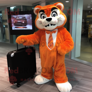 Orange Bobcat mascot costume character dressed with a Cover-up and Briefcases