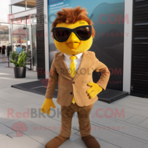 Brown Canary mascot costume character dressed with a Suit Pants and Sunglasses