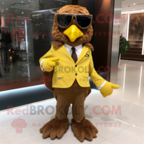 Brown Canary mascot costume character dressed with a Suit Pants and Sunglasses