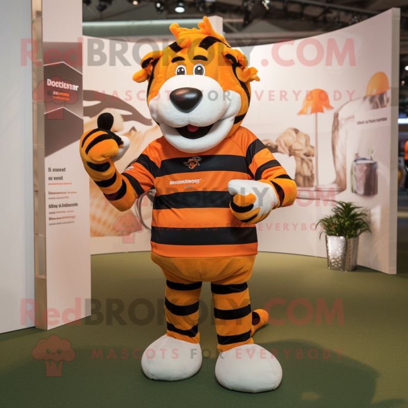 Orange Zebra mascot costume character dressed with a Rugby Shirt and Beanies Orange Zebra mascot costume character dressed with a Rugby Shirt and Beanies