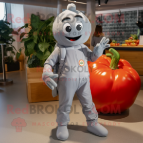 Silver Tomato mascot costume character dressed with a Jumpsuit and Messenger bags