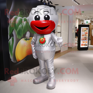 Silver Tomato mascot costume character dressed with a Jumpsuit and Messenger bags