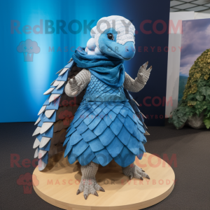 Blue Pangolin mascot costume character dressed with a Wrap Skirt and Shawls