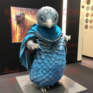 Blue Pangolin mascot costume character dressed with a Wrap Skirt and Shawls