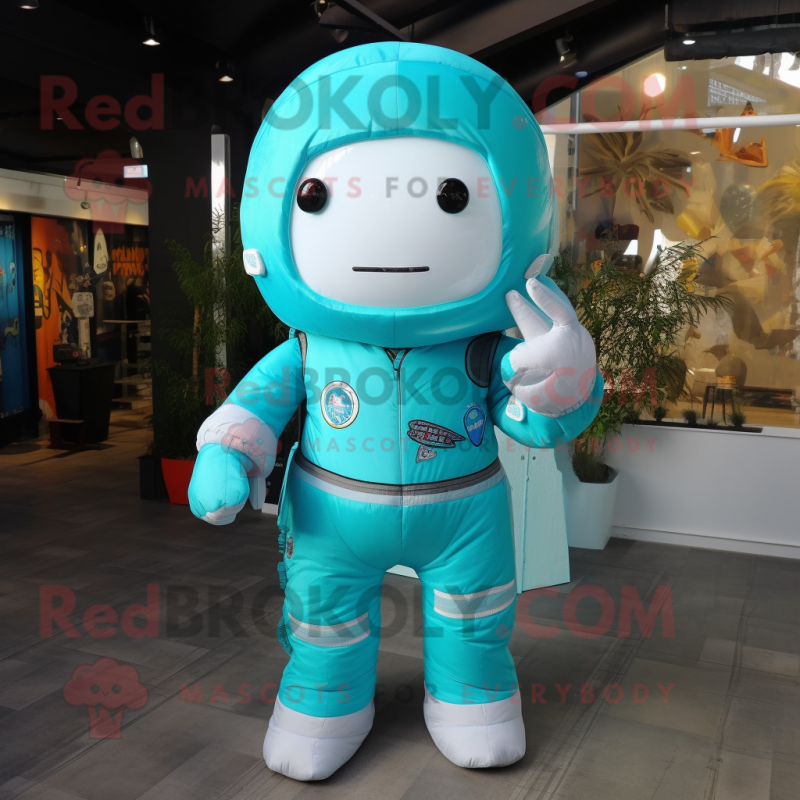 Turquoise Astronaut mascot costume character dressed with a Hoodie and Pocket squares