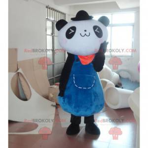 Czarno-biała maskotka panda w niebieskiej sukience