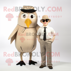 Beige Blackbird mascot costume character dressed with a Romper and Pocket squares