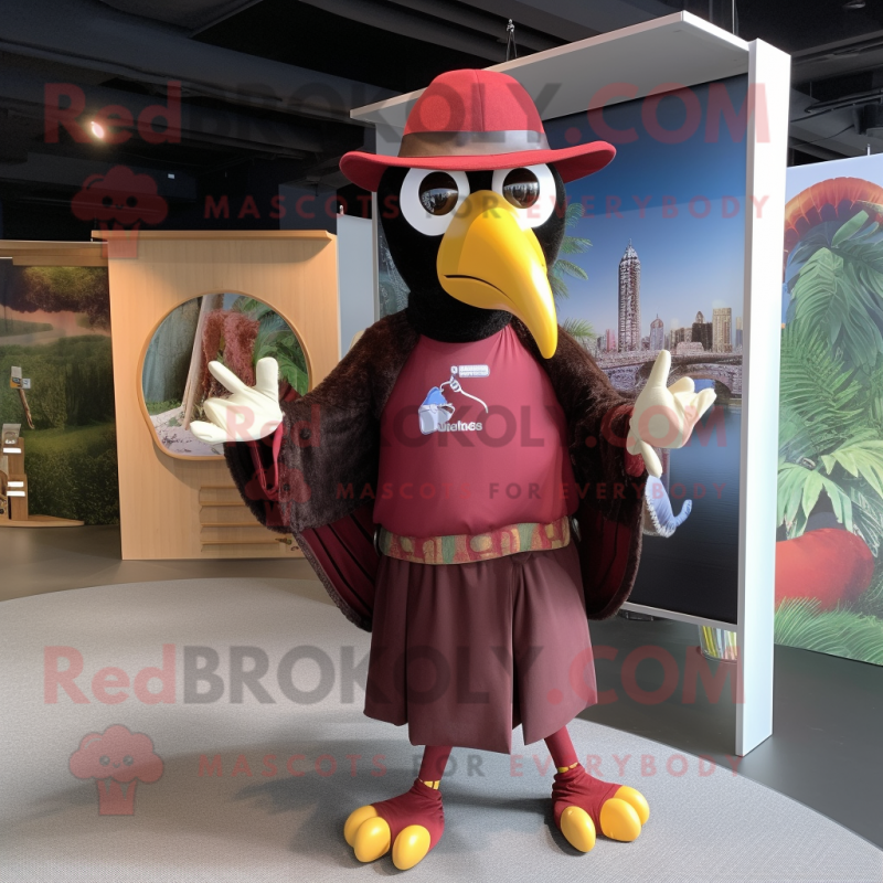 Maroon Toucan mascot costume character dressed with a Long Sleeve Tee and Hat pins