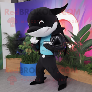 Black Killer Whale mascot costume character dressed with a Chinos and Digital watches