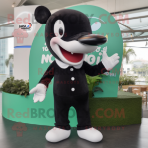 Black Killer Whale mascot costume character dressed with a Chinos and Digital watches