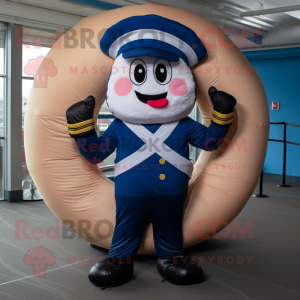 Navy Donut mascot costume character dressed with a Joggers and Gloves