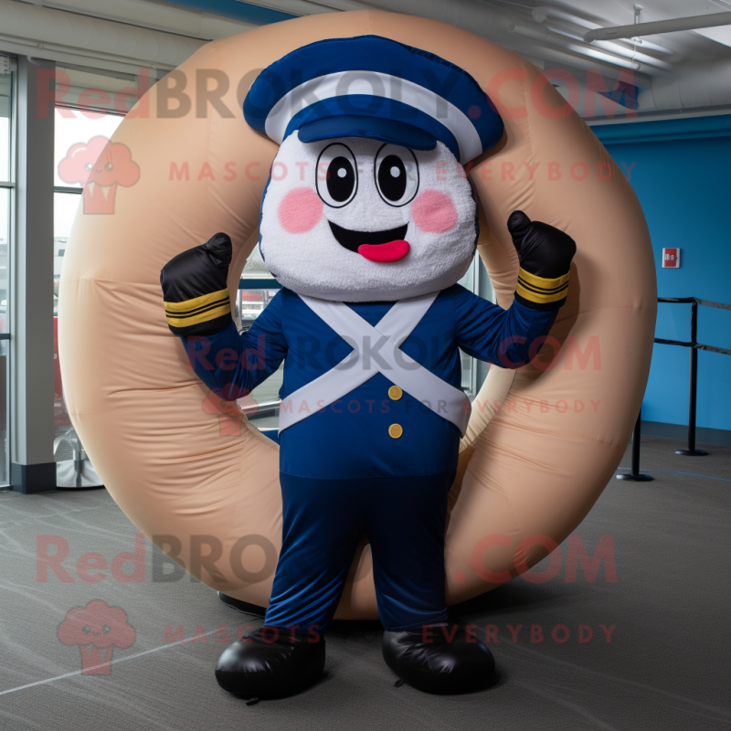 Navy Donut mascot costume character dressed with a Joggers and Gloves Navy Donut mascot costume character dressed with a Joggers and Gloves
