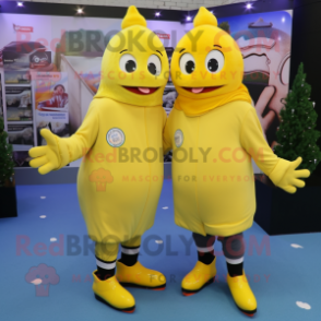 Lemon Yellow Pair Of Ice Skates mascot costume character dressed with a Hoodie and Beanies