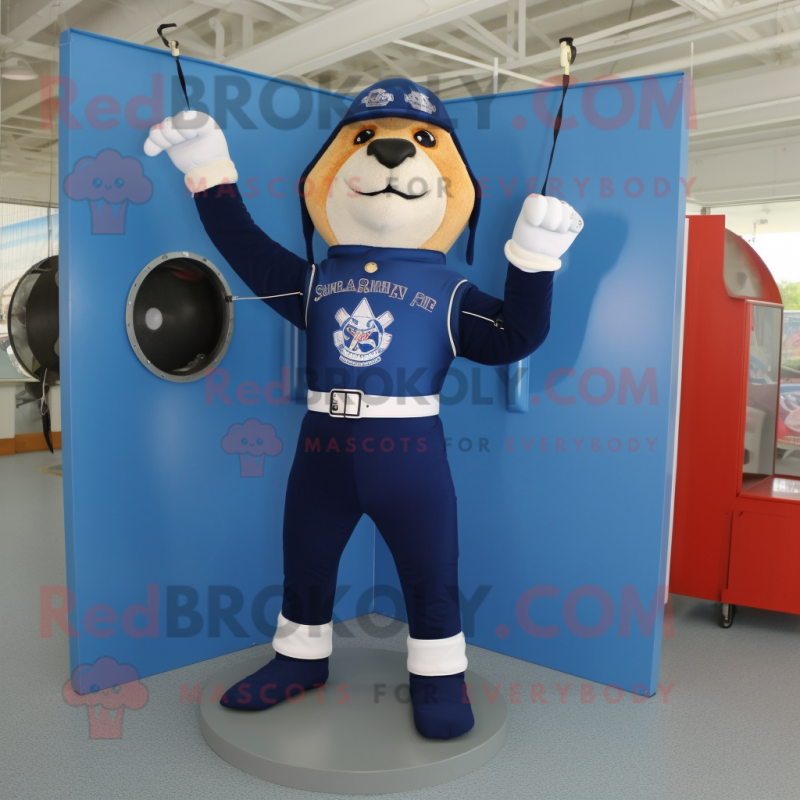 Navy Trapeze Artist mascot costume character dressed with a Rash Guard and Messenger bags