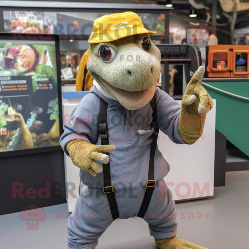 nan Komodo Dragon mascot costume character dressed with a Dungarees and Beanies