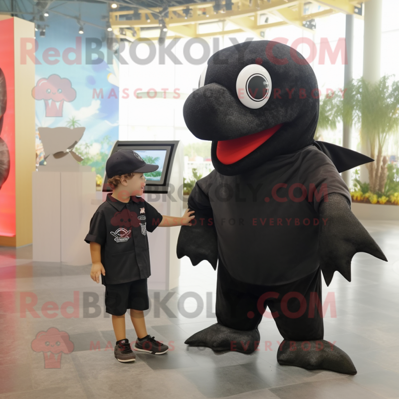 Black Stingray mascot costume character dressed with a Vest and Watches Black Stingray mascot costume character dressed with a Vest and Watches