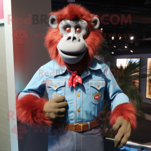 Red Baboon mascot costume character dressed with a Denim Shirt and Tie pins