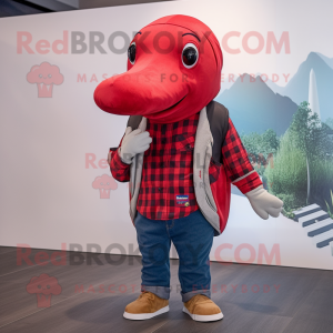 Red Humpback Whale mascot costume character dressed with a Flannel Shirt and Caps