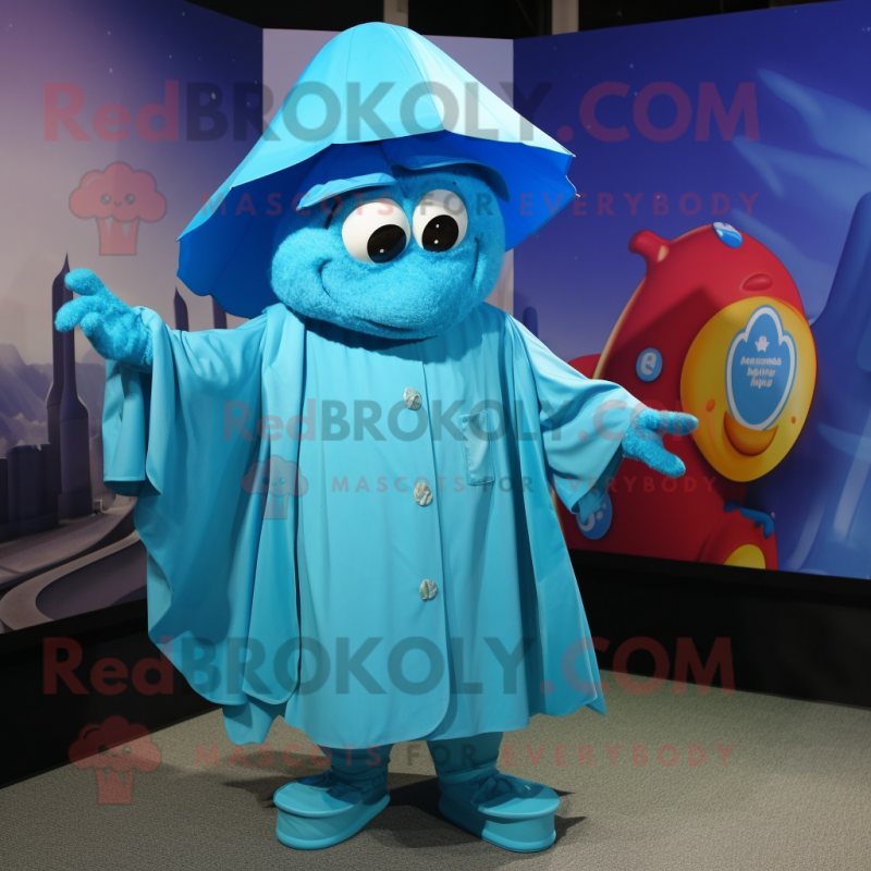 Cyan Momentum mascot costume character dressed with a Raincoat and Shawls