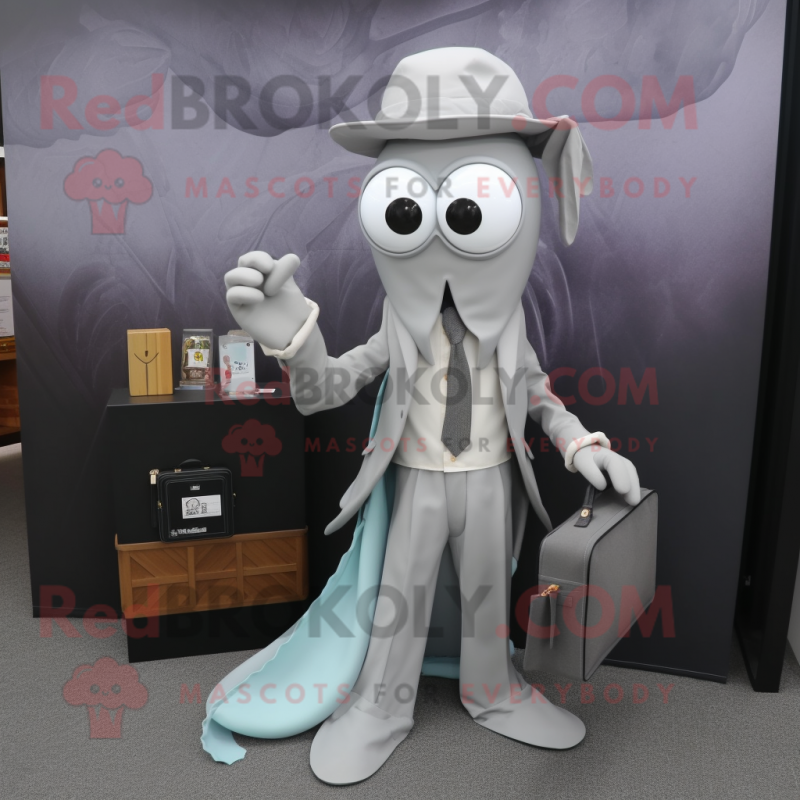 Silver Squid mascot costume character dressed with a Dress Shirt and Wallets