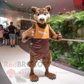 Brown Thylacosmilus mascot costume character dressed with a Running Shorts and Hair clips