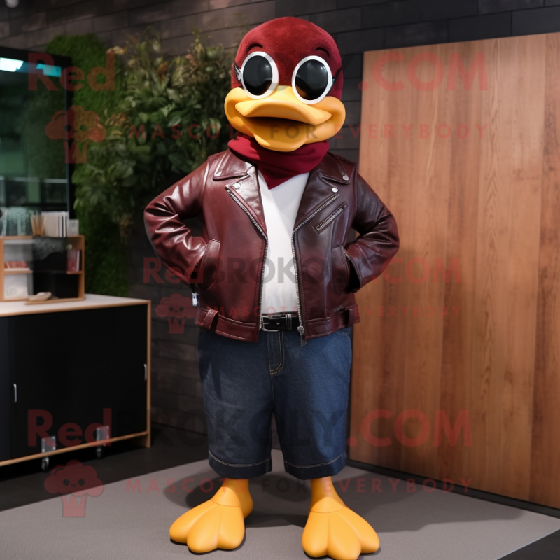 Maroon Duck mascot costume character dressed with a Leather Jacket and Reading glasses Maroon Duck mascot costume character dressed with a Leather Jacket and Reading glasses