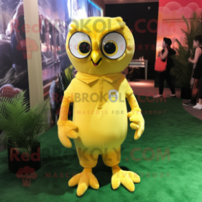 Yellow Owl mascot costume character dressed with a Polo Tee and Lapel pins