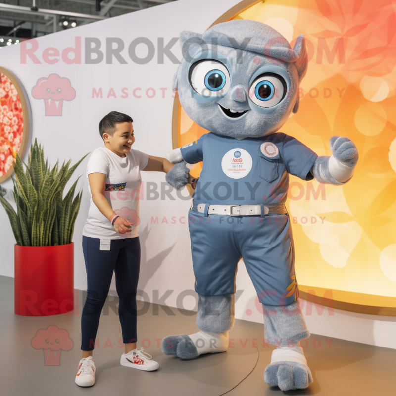 Silver Fire Eater mascot costume character dressed with a Denim Shorts and Smartwatches Silver Fire Eater mascot costume character dressed with a Denim Shorts and Smartwatches