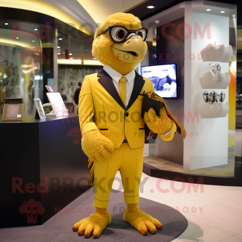 Gold Falcon mascot costume character dressed with a Suit Pants and Handbags Gold Falcon mascot costume character dressed with a Suit Pants and Handbags