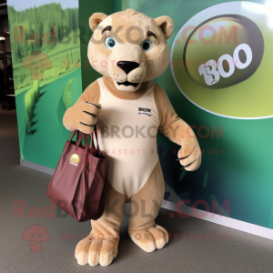 Tan Smilodon mascot costume character dressed with a Rash Guard and Tote bags