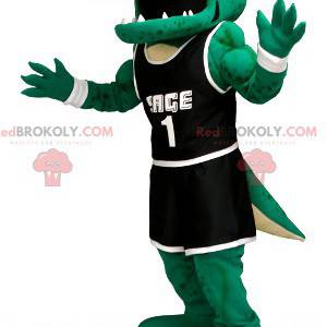 Grünes Krokodilmaskottchen in schwarzer Sportbekleidung