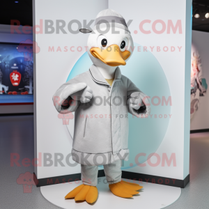 Silver Goose mascot costume character dressed with a Coat and Beanies