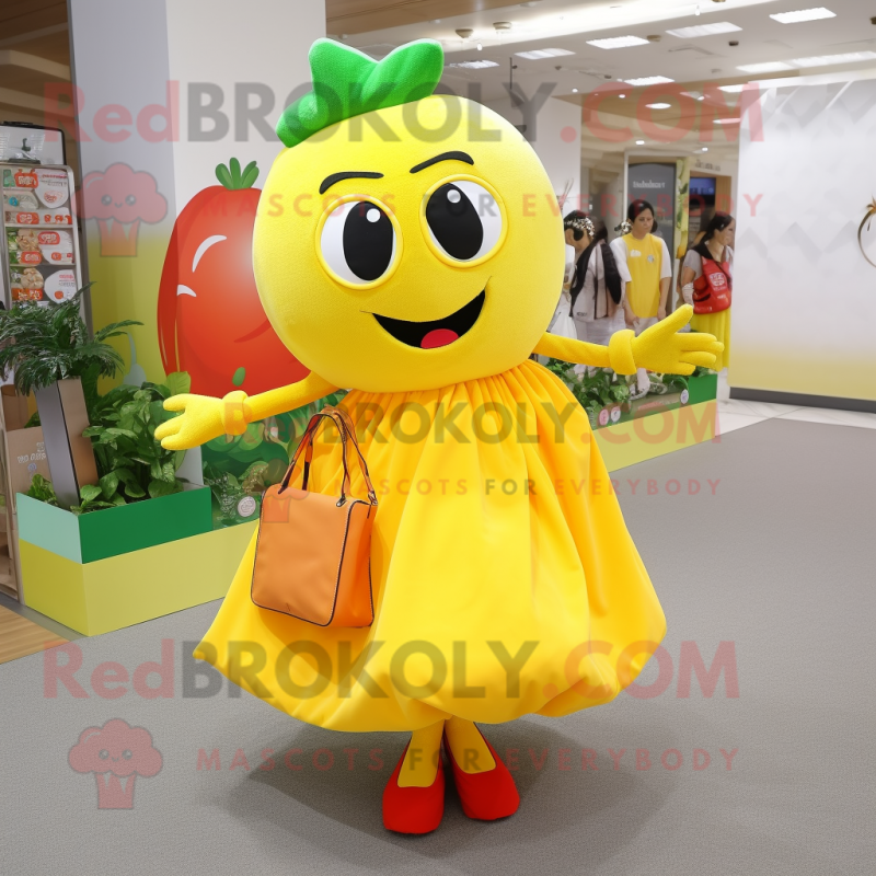 Yellow Tomato mascot costume character dressed with a Dress and Clutch bags Yellow Tomato mascot costume character dressed with a Dress and Clutch bags