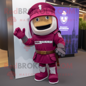 Magenta Roman Soldier mascot costume character dressed with a Bootcut Jeans and Lapel pins