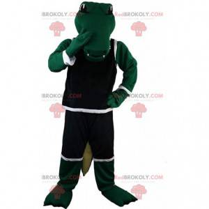 Green crocodile mascot in sportswear, alligator costume -