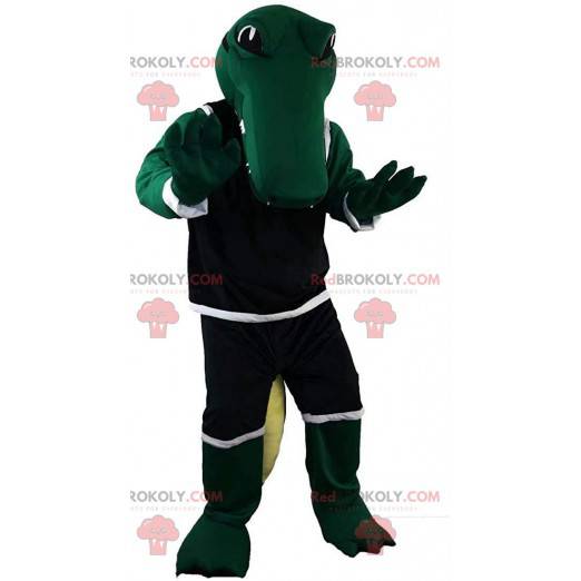 Mascote crocodilo verde em roupas esportivas, fantasia de