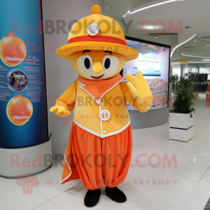 Peach Ring Master mascot costume character dressed with a Polo Shirt and Shawl pins